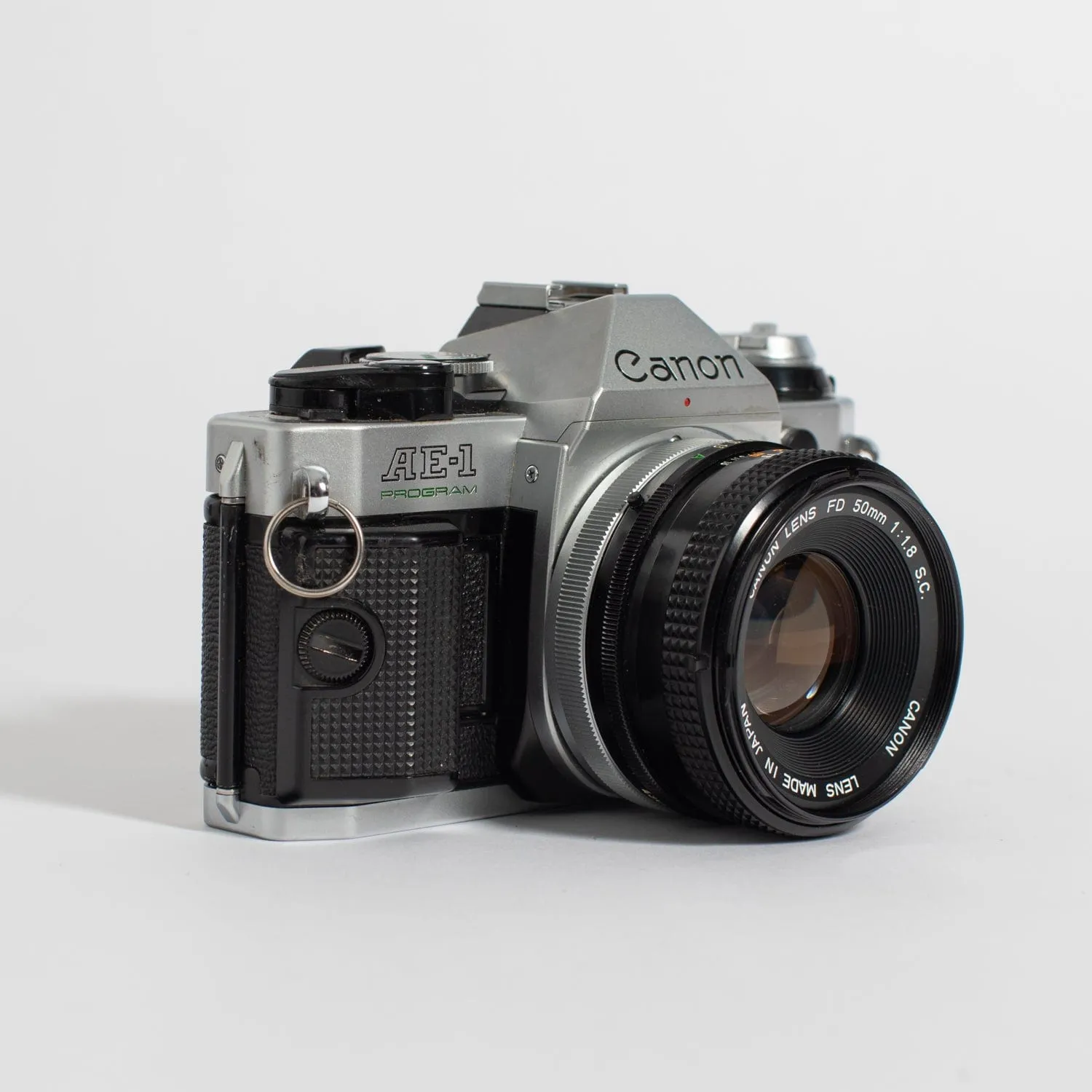 Canon AE-1 (35mm Kit) with 50mm f/1.8 and 70-150 mm lens